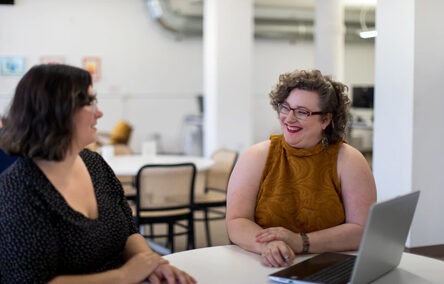 Two women speaking